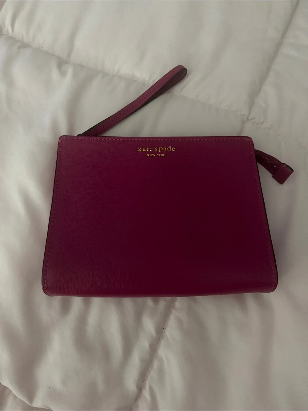 kate spade magenta wristlet clutch with gold logo